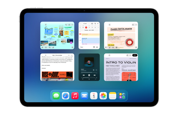 iPad na horizontal mostrando seis janelas abertas em duas linhas, incluindo os apps Calendário, Notas, Música e Safari